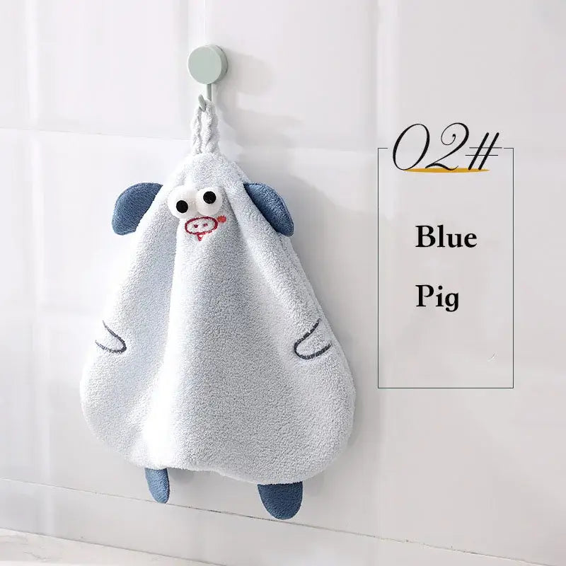 Yellow and gray decorbites cartoon animal hand towel made of soft plush featuring a light blue pig design with embroidered details