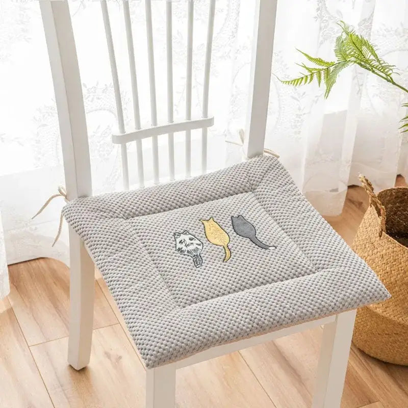 Gray textured seat cushion with yellow and white decorbites cartoon embroidered cat designs for dining room use