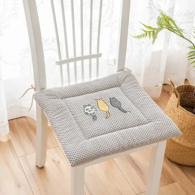 Gray textured seat cushion with yellow white and gray cartoon embroidered cat designs for dining room decorbites seat cushions