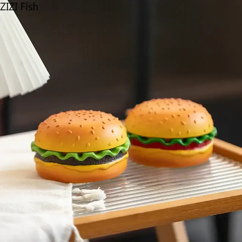 Two miniature colorful plastic sesame seed bun cartoon burger ashtrays for office table desk decor by decorbites