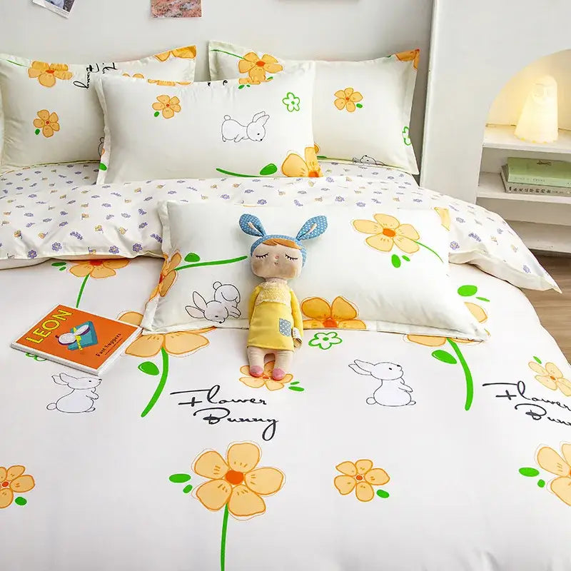 Yellow and light blue carrot cartoon printed bedding set with white floral and bunny decorbites cartoon printed design