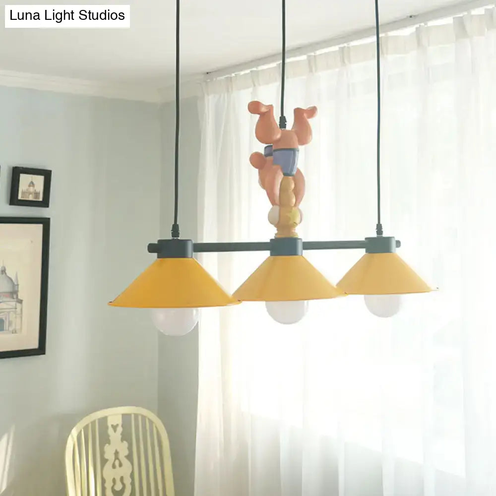 DecorBites three-head yellow cone pendant lamp with black metal fixture and peach ceramic pig figurine detail e26 e27