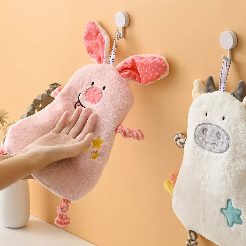 Pink plush hand towel shaped like a cartoon animal with polka-dotted ears and embroidered face for decorbites cartoon animal decor
