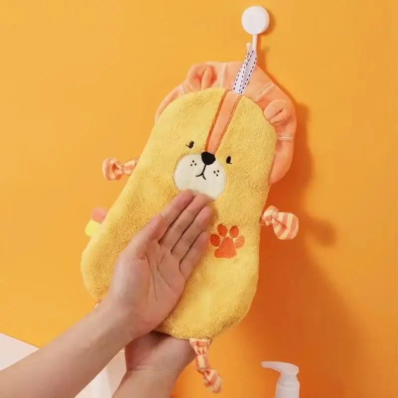 Yellow plush lion-shaped bath sponge with orange accents and embroidered features for hand towel cartoon animal decorbites cartoon animal bathroom decor