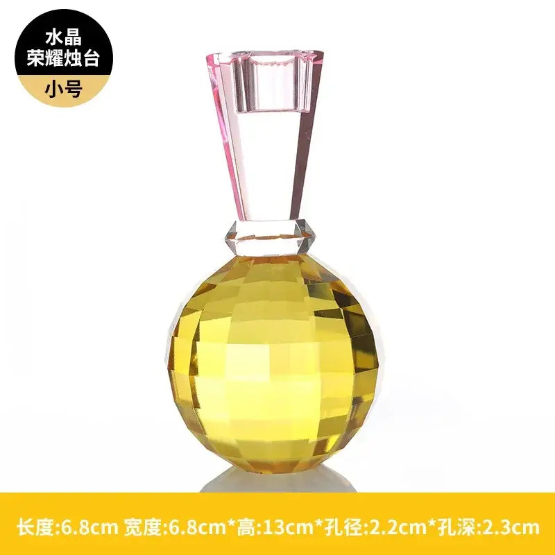 Yellow and pink faceted crystal candle holder with a glass stem for a dining room centerpiece