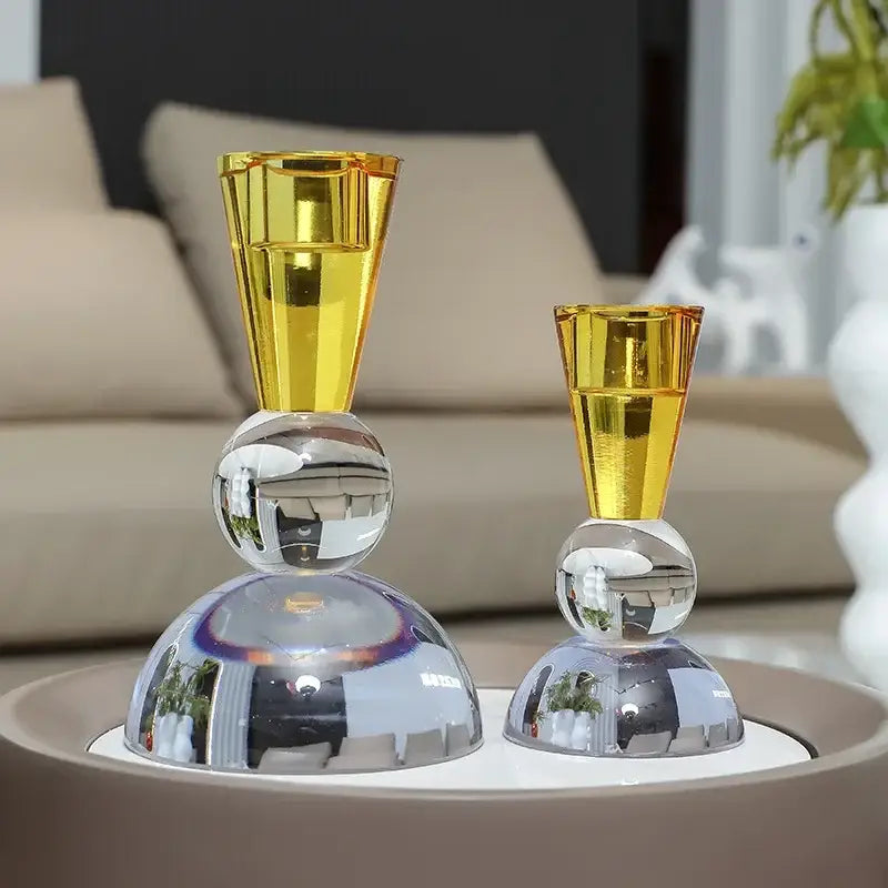 Yellow and pink crystal candle holder with golden translucent glass and reflective chrome spheres for dining room centerpiece