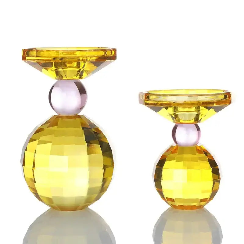 Yellow and pink crystal candle holder featuring faceted yellow spheres and a central pinkish bead for dining room centerpiece