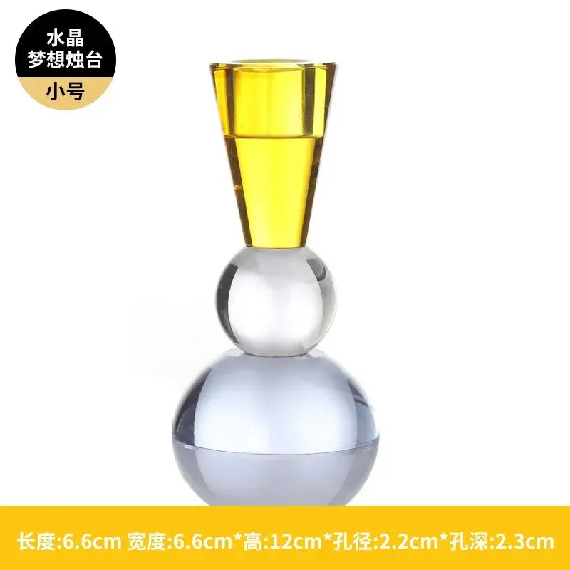 A sleek crystal candle holder with a vibrant yellow top and transparent spherical tiers perfect as a dining room centerpiece