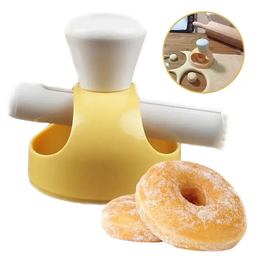 Yellow plastic donut cutter with white handle and rolling pin attachment in a baking tools kit for kitchen use