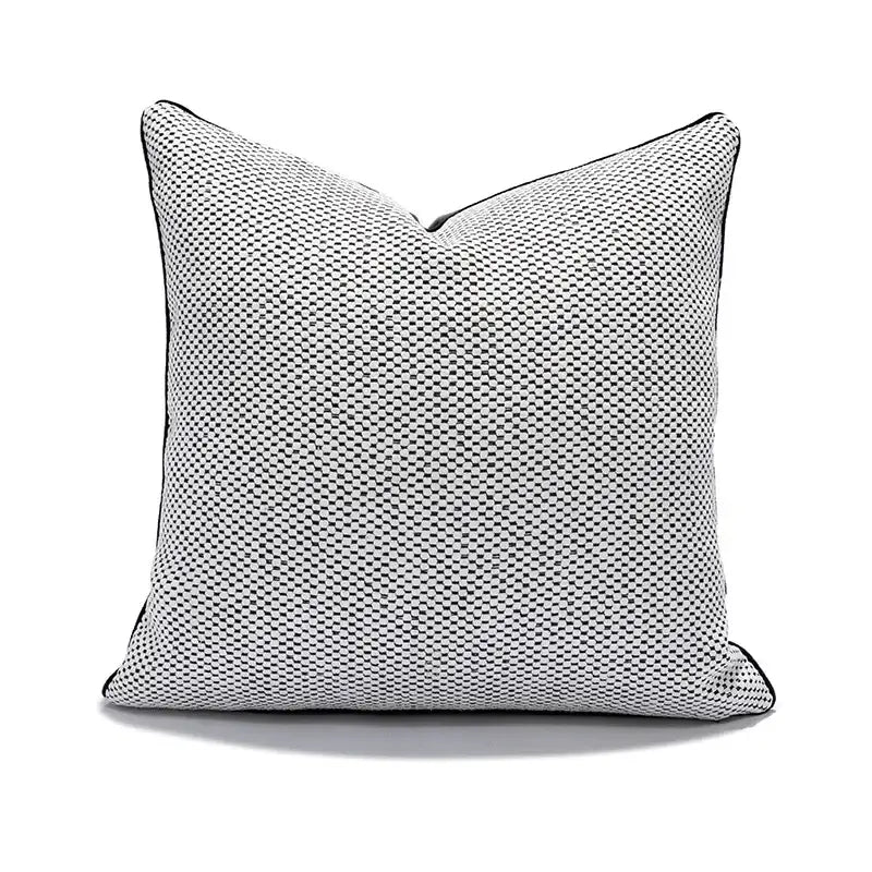 Square-shaped cushion cover with textured black and white checkered fabric and black piping for decorbites geometric elephant decor