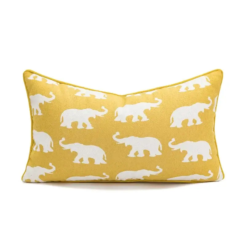 Yellow cushion cover with white geometric elephant silhouettes for decorbites geometric elephant living room decor