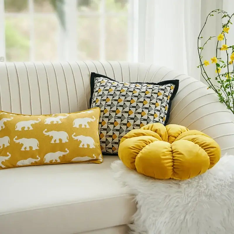 Yellow velvet pumpkin-shaped cushion complementing decorbites geometric elephant cushion cover for living room decor