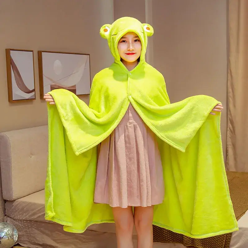Bright lime green plush frog-themed hooded cape blanket with soft fuzzy texture and rounded ear details for warmth