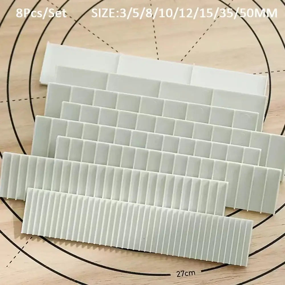 Set of eight white plastic adhesive strips with ribbed surfaces for biscuit cake rolling using cake rolling mold decorbites biscuit cake