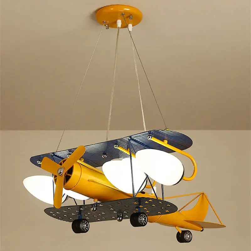 Vibrant yellow and blue vintage biplane bluetooth speaker lamp with white illuminated wings for kids room decorbites