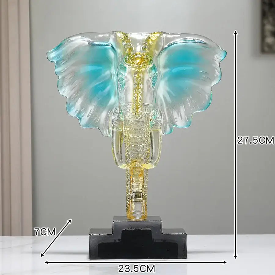 A translucent blue and gold decorbites crystal elephant sculpture on black base perfect for home decor