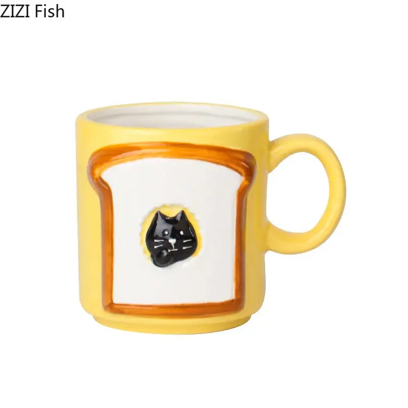 Yellow ceramic bread pattern ceramic cup with white toast design orange border and black cat face appliqué