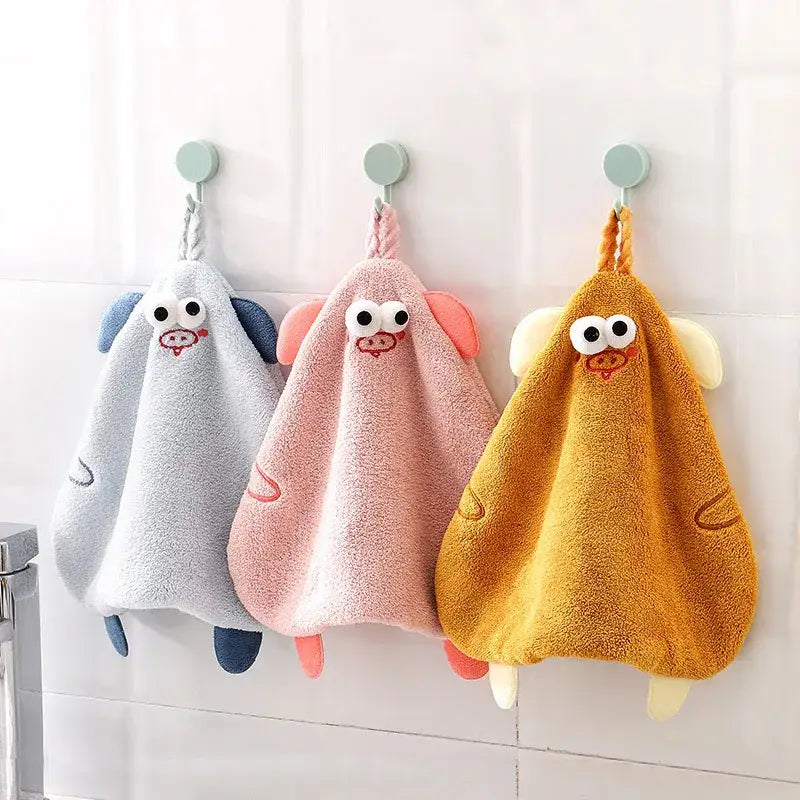 Yellow cartoon pig plush hand towel with embroidered face and terry cloth texture for bathroom or kitchen decorbites cartoon pig