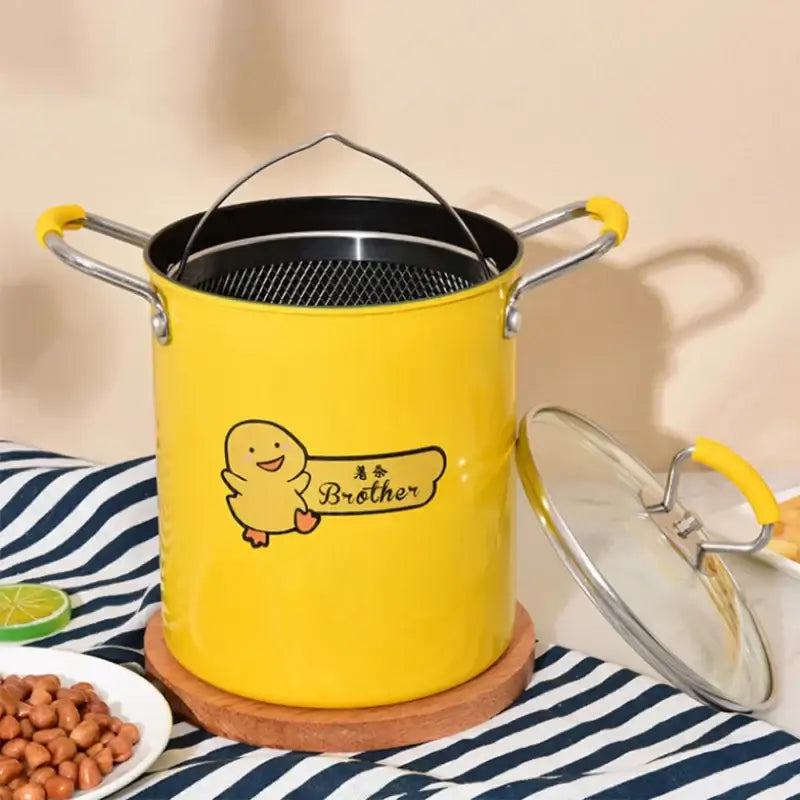 Yellow enamel decorbites deep fryer with stainless steel handles mesh insert and cartoon duck holding brother sign