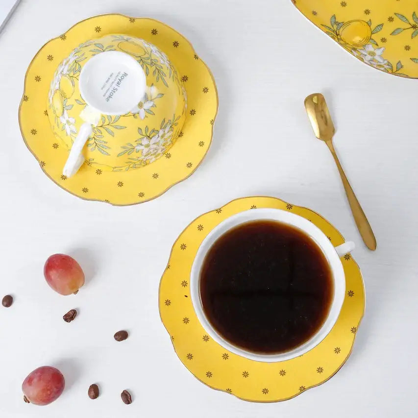 Yellow floral-patterned royal doulton lemon tree bone china teacup and saucer set with gold-trimmed edges decorbites lemon tree