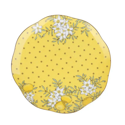 A vibrant yellow lemon tree bone china plate with delicate white flowers and green leaves for dining room decorbites
