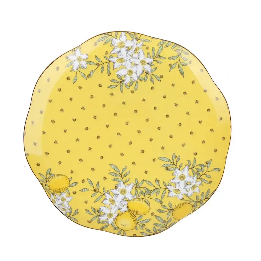 A vibrant yellow lemon tree bone china plate with delicate white flowers and green leaves for dining room decorbites