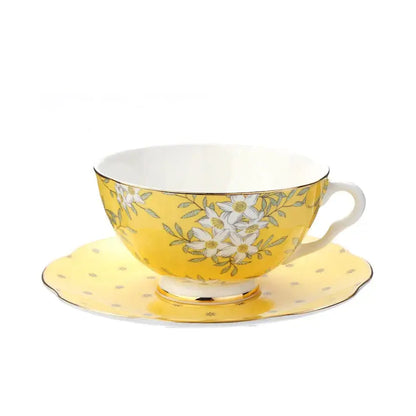 Yellow porcelain lemon tree bone china teacup with white floral pattern and gold trim with matching saucer decorbites lemon tree
