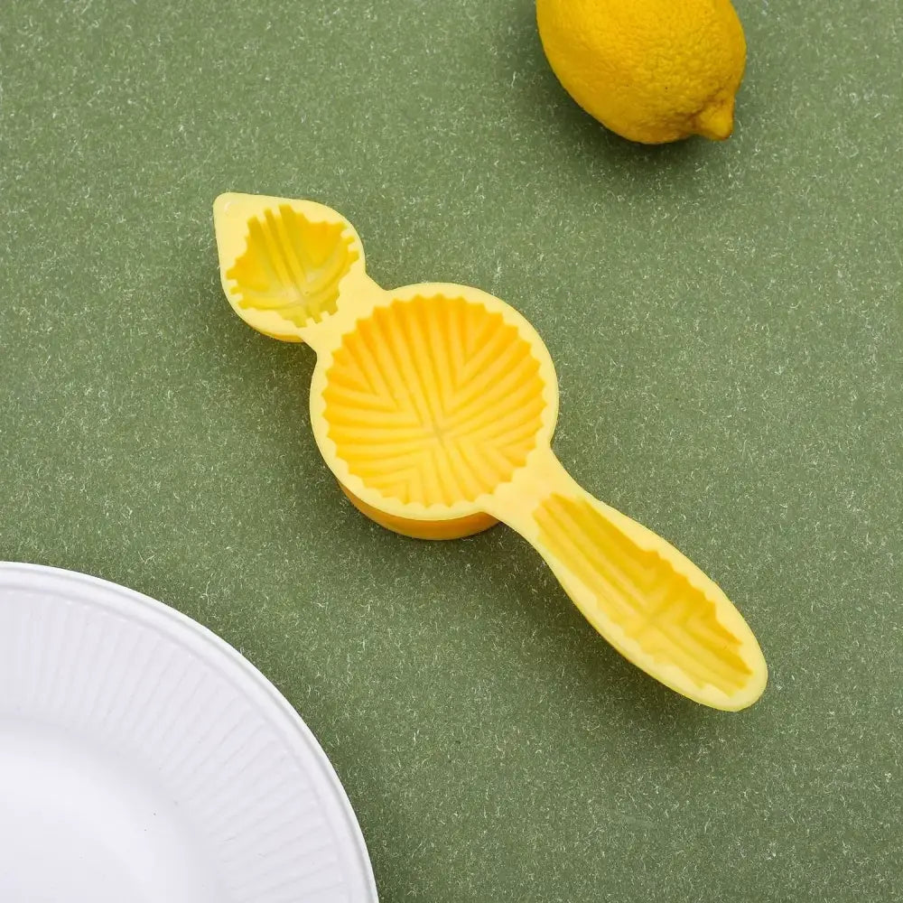 Yellow floral silicone biscuit cake date pistachio mold with bright yellow silicone lemon squeezer and leaf design