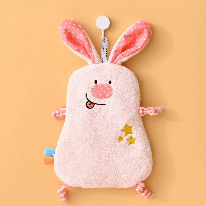 Pink plush bunny-shaped hand towel with embroidered face and patterned ears and limbs from decorbites cartoon animals hand collection