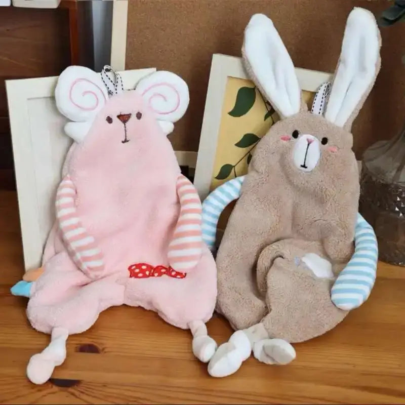 Pink plush mouse keychain with striped arms and red bow beside beige bunny pouch, complementing yellow giraffe cartoon animals hand towel decorbites cartoon animals hand decor