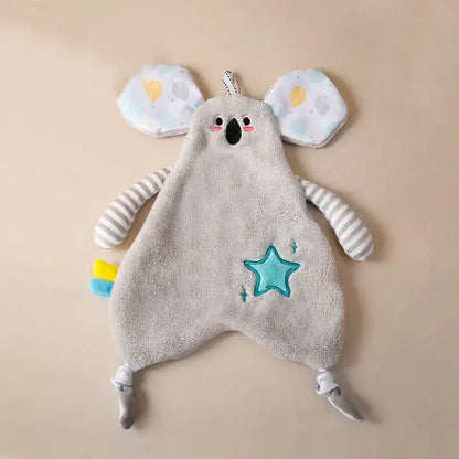 Soft gray koala-shaped baby comforter with striped arms and teal star detail alongside yellow giraffe decorbites cartoon animals hand towel