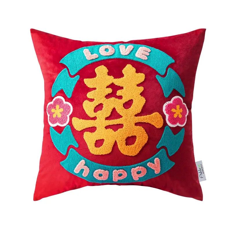 Red velvet cushion cover with orange double happiness embroidery and teal ribbons featuring love and happy for decorbites good fortune