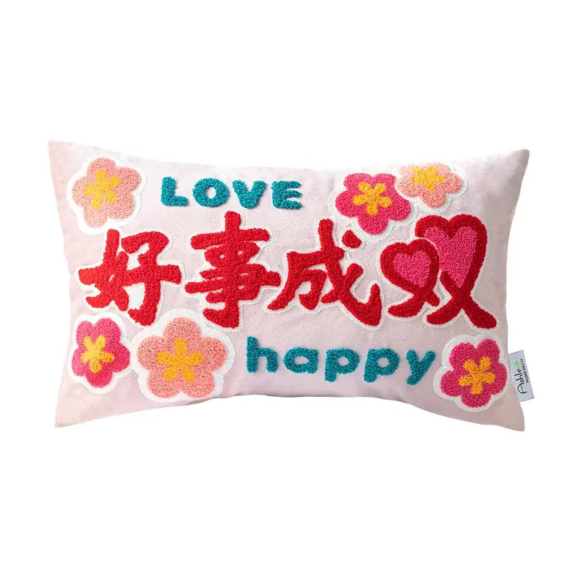 A soft pink cushion cover with colorful good fortune embroidered flowers and the phrase love 好事成双 for decorbites living room decor