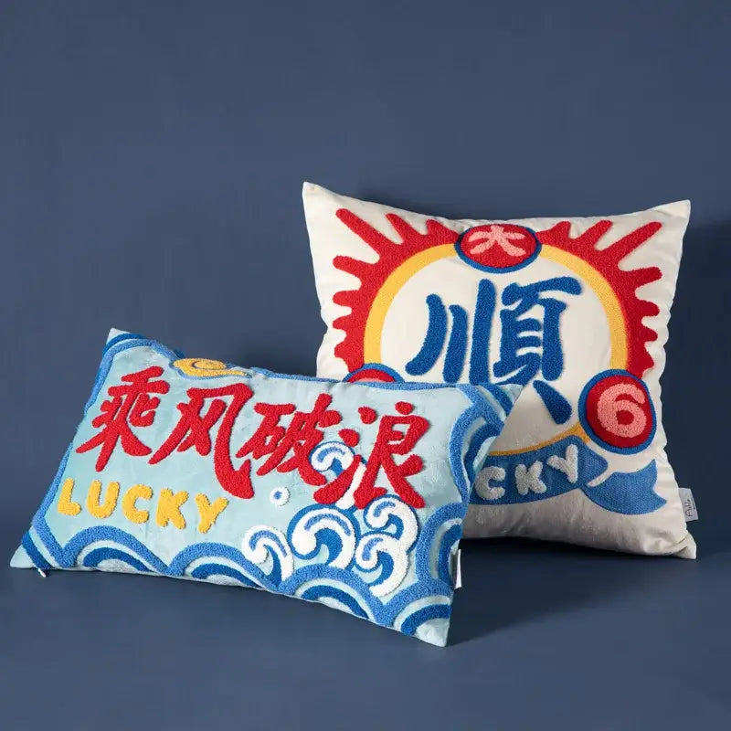 Two embroidered cushion covers featuring good fortune embroidered designs in yellow blue and red for living room decorbites decor