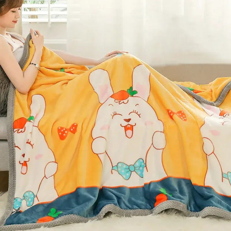 Yellow and gray bunny cartoon flannel blanket featuring plush yellow fabric with cartoon bunnies and gray textured border decorbites cartoon flannel