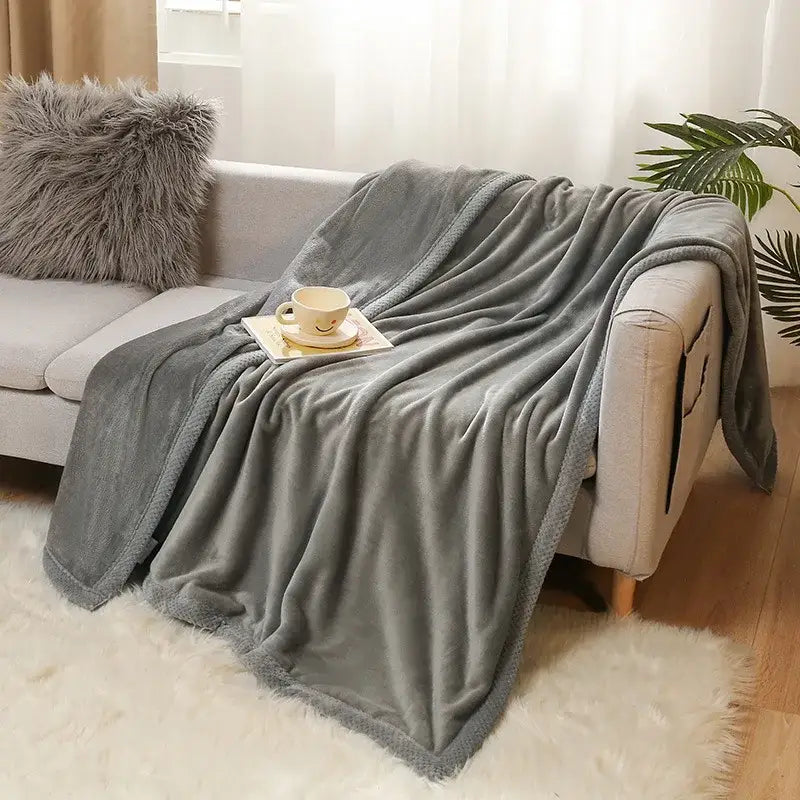 Soft gray plush throw blanket with textured fuzzy surface and fringed edges for decorbites cartoon flannel bedding decor