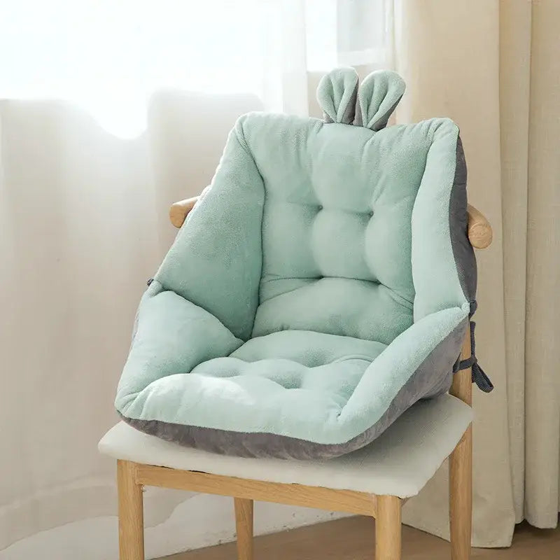 A soft mint green and gray decorbites cartoon velvet chair cushion with bunny ear accents for bedroom back support
