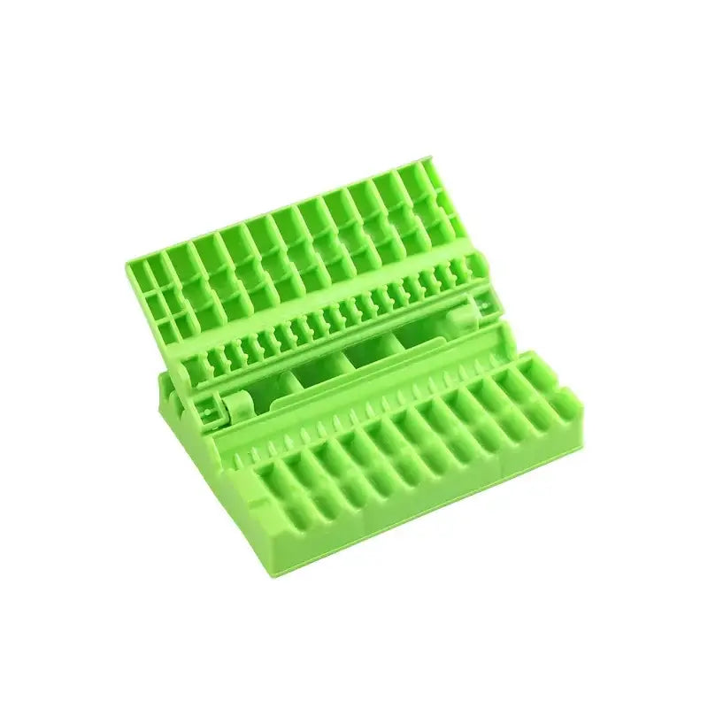Bright green plastic hinged tool organizer with compartments for yellow and green bbq meat skewer maker kitchen tool