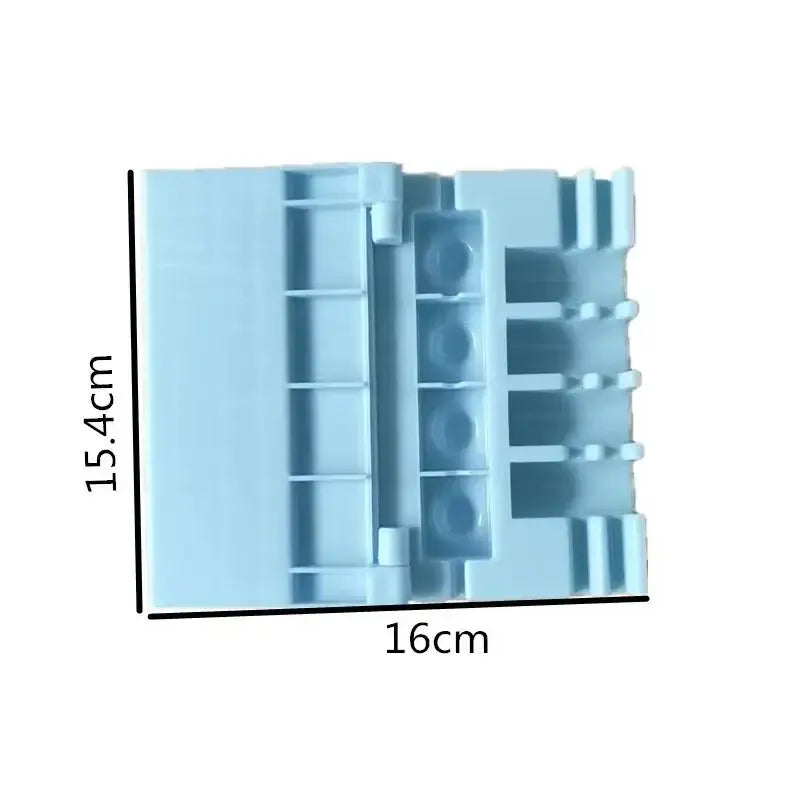 Light blue plastic lego connector piece for yellow and green bbq meat skewer maker kitchen kebab tool