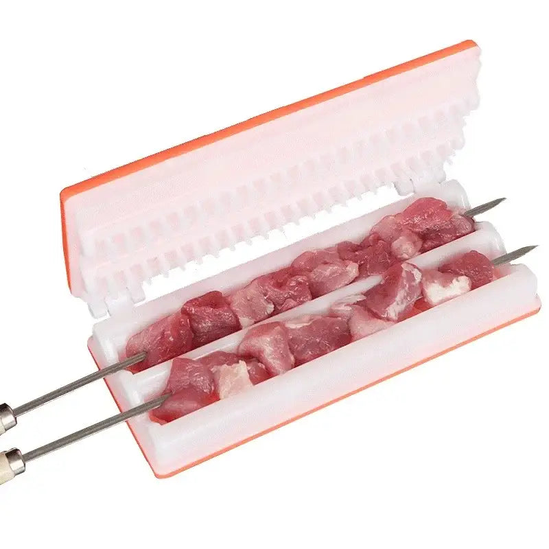 Yellow and green plastic bbq meat skewer maker with ridged interior for evenly spacing raw pork chunks on metal skewers