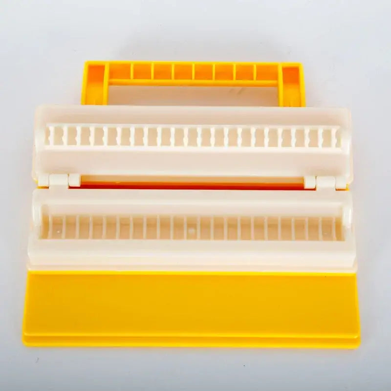 Yellow and white plastic sushi roll maker with handle for making bbq meat skewers as a meat skewer maker tool