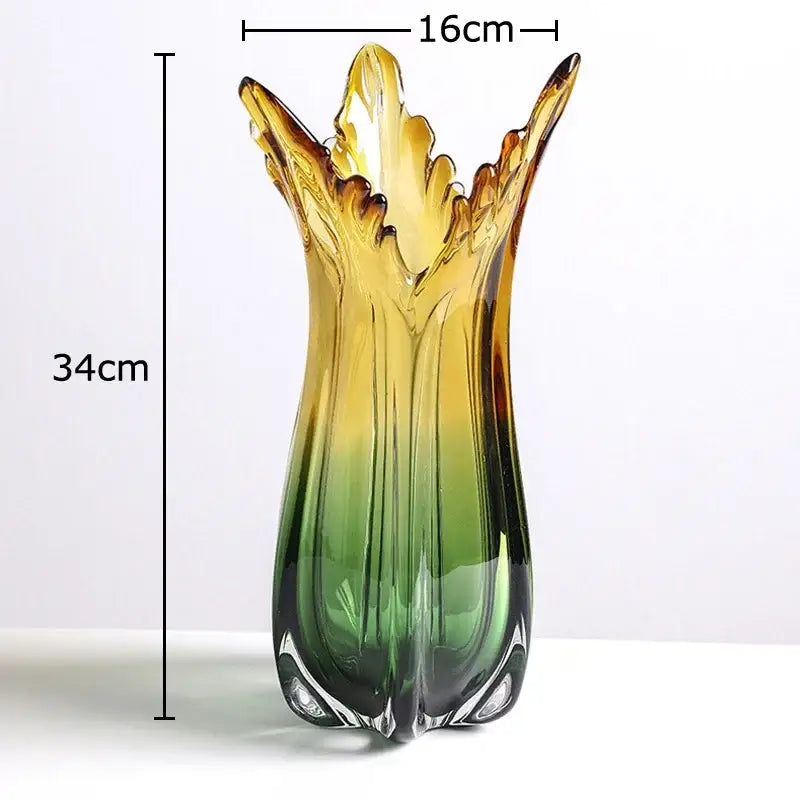 A tall slender glass vase with a green glass vase gradient and ornate leaf rim for artificial flowers hydroponics use