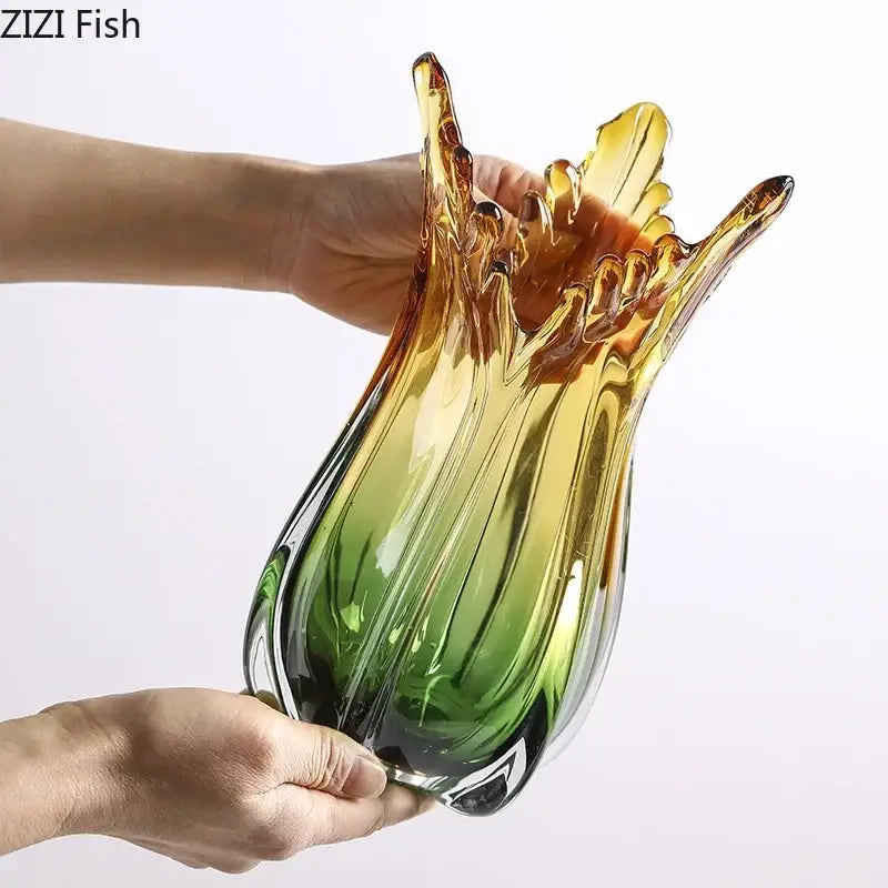 A yellow and green glass vase hydroponics with a tulip silhouette for artificial flowers in dining room decor