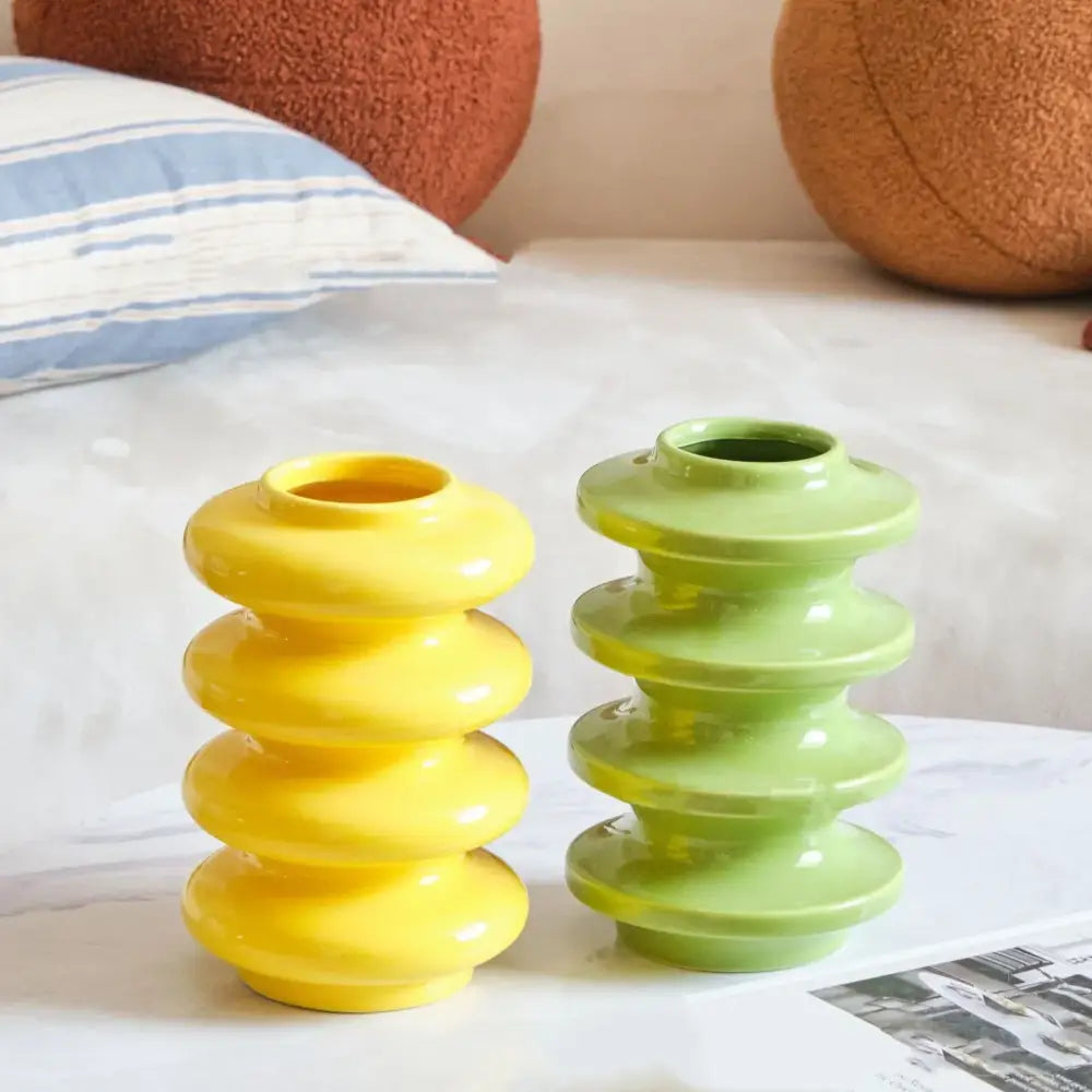 A pair of yellow and lime green glossy ceramic vases with geometric circles abstract design for living room decorbites