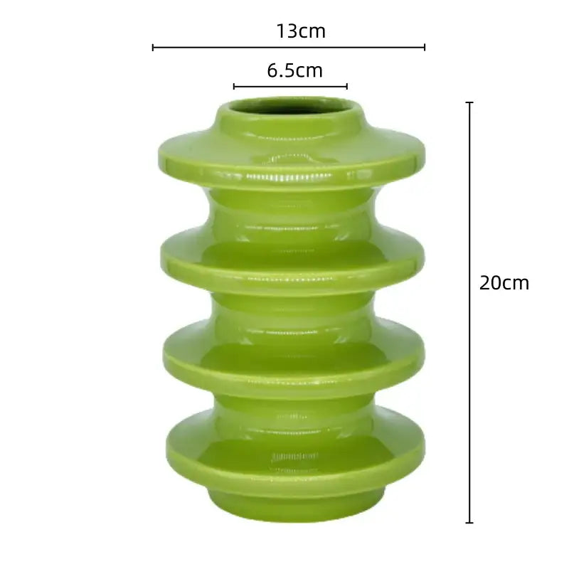 A glossy lime green ceramic vase with a tiered segmented design and flared rim for geometric circles abstract decorbites decor