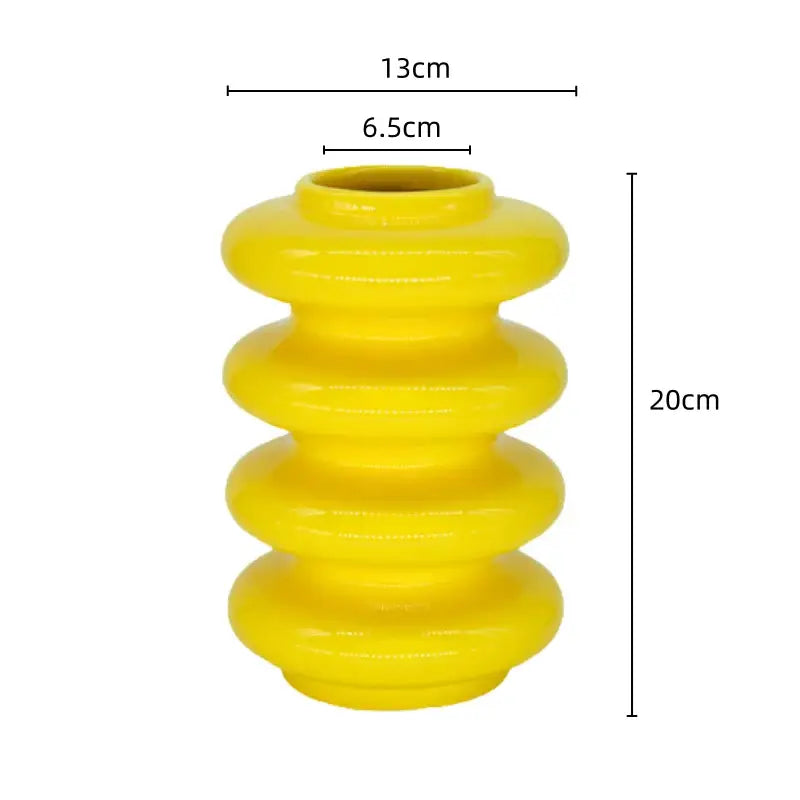 Bright yellow ribbed ceramic vase with sleek segmented design for living room decorbites geometric circles abstract decor