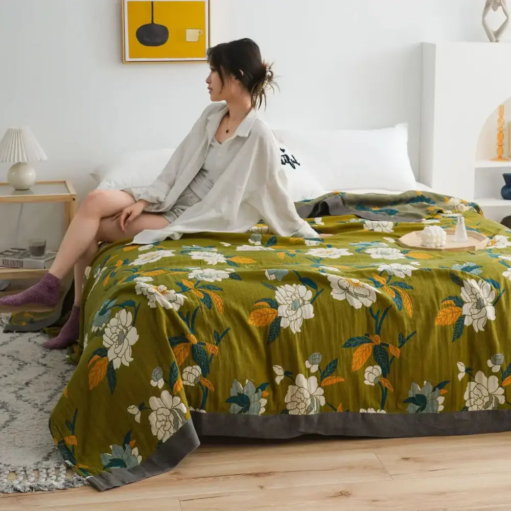 Olive green floral decorbites cotton gauze soft throw blanket with white yellow blossoms and dark gray border for bedroom