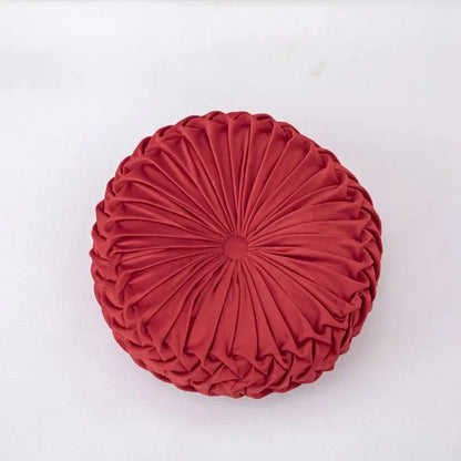 A plush circular red velvet throw pillow with radial pleated design ideal for decorbites 3d pumpkin decorbites pumpkin vehicle wheel themes