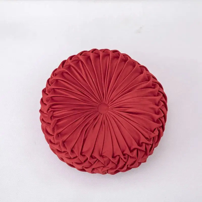 A plush circular red velvet throw pillow with radial pleated design ideal for decorbites 3d pumpkin decorbites pumpkin vehicle wheel themes