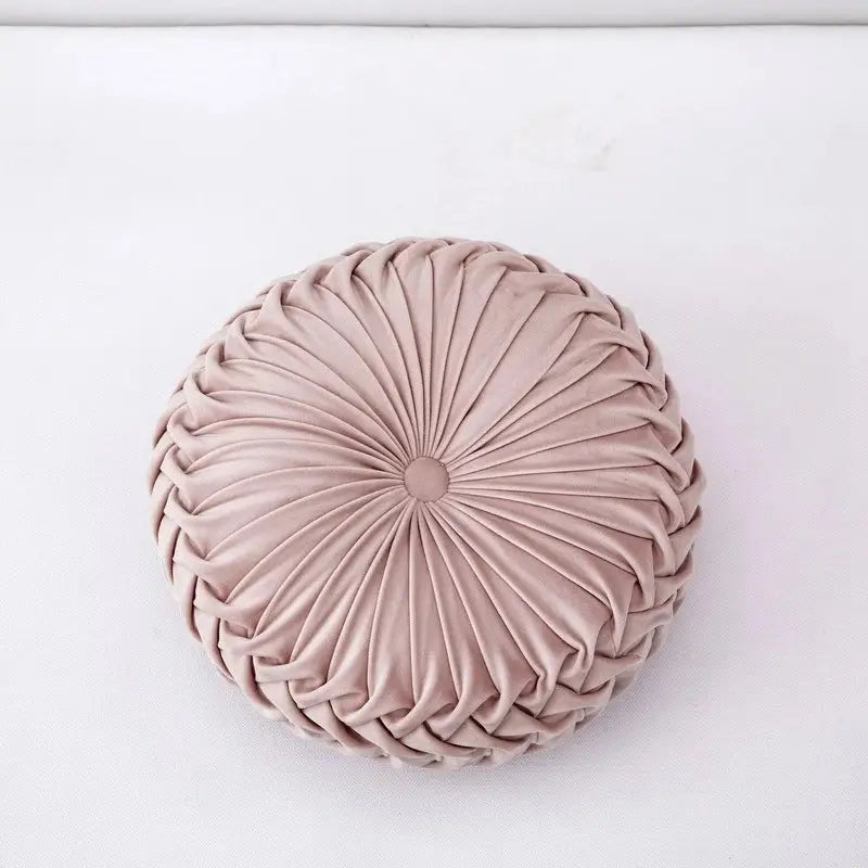 A blush pink velvet throw pillow with circular pleated design ideal for decorbites 3d pumpkin living room decor